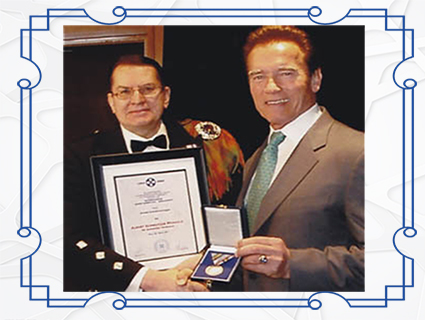 Arnold Alois Schwarzenegger awarded Albert Schweitzer Neck Cross